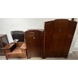 A 20th century oak three piece bedroom suite comprising two wardrobes and a dressing table