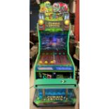 A UDC Zombie Crisis arcade machine with integrated two player bench, interactive firing action,