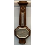 An oak cased aneroid barometer