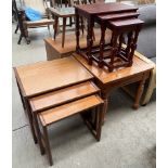 A nest of three G-Plan teak tables together with another nest of tables and a pine side table