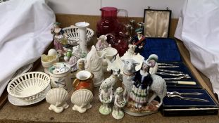 Three silver candlesticks together with cased nut crackers, cranberry glass jugs,