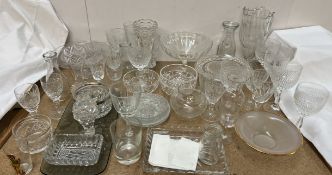 Various glass vases together with drinking glasses,