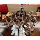 A set of four faux antler wall lights from David Hunt Lighting,