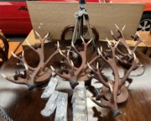 A set of four faux antler wall lights from David Hunt Lighting,
