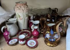 A collection of copper lustre jugs,