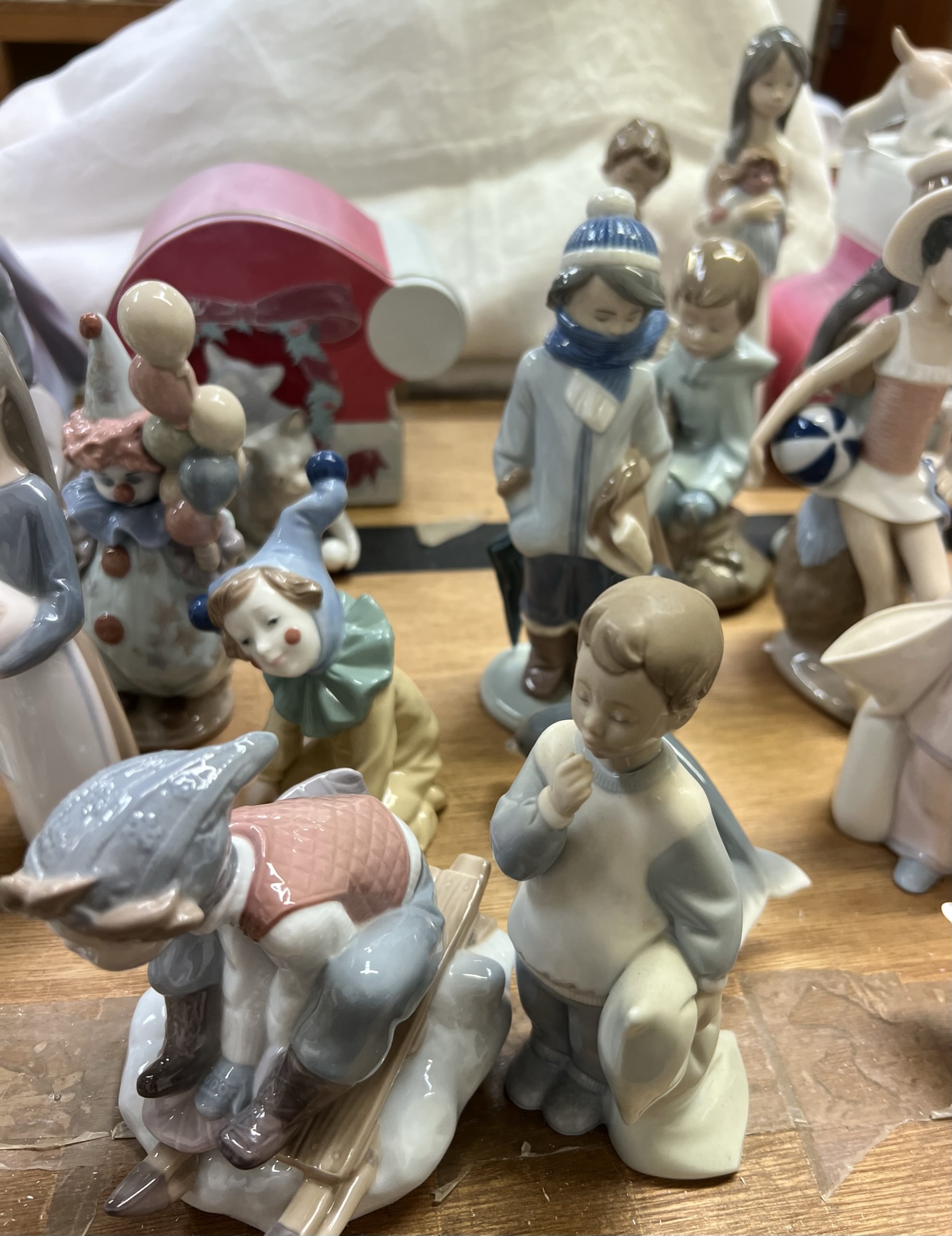 A collection of Lladro and Nao porcelain figures including a balloon girl, clown, children, - Image 3 of 4