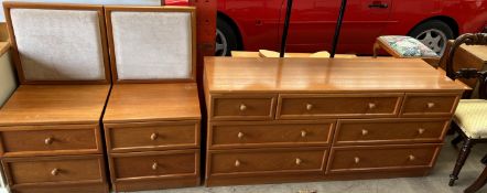 G-Plan a pair of teak chests with pad upholstered backs and a matching chest of drawers