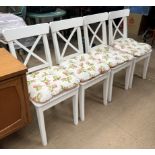 A set of four white painted modern dining chairs