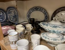 Assorted blue and white meat plates together with Hovis wall clocks, commemorative mugs,