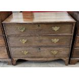 A 19th century oak chest with three long graduated drawers on bracket feet,