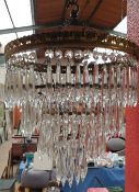 A glass chandelier style light shade together with extra pieces