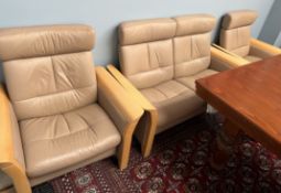 A beech framed and brown leather three piece suite