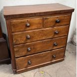 A Victorian mahogany chest with a rectangular top and rounded corners above two short and three