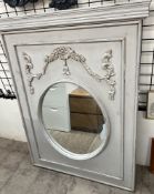 A large rectangular panel with a circular wall mirror inset