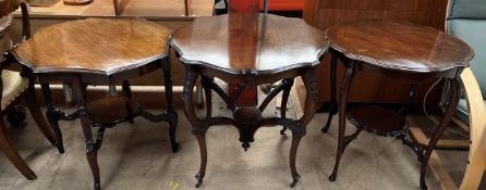 An Edwardian mahogany occasional table of shaped circular form on four shaped legs united by an