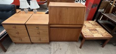 A mid 20th century teak bureau together with a pair of teak effect bedside chests and a tiled top