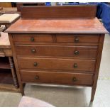 An Edwardian mahogany dressing chest with two short and three long graduated drawers on square