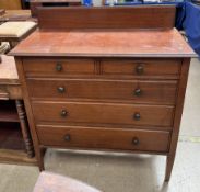 An Edwardian mahogany dressing chest with two short and three long graduated drawers on square