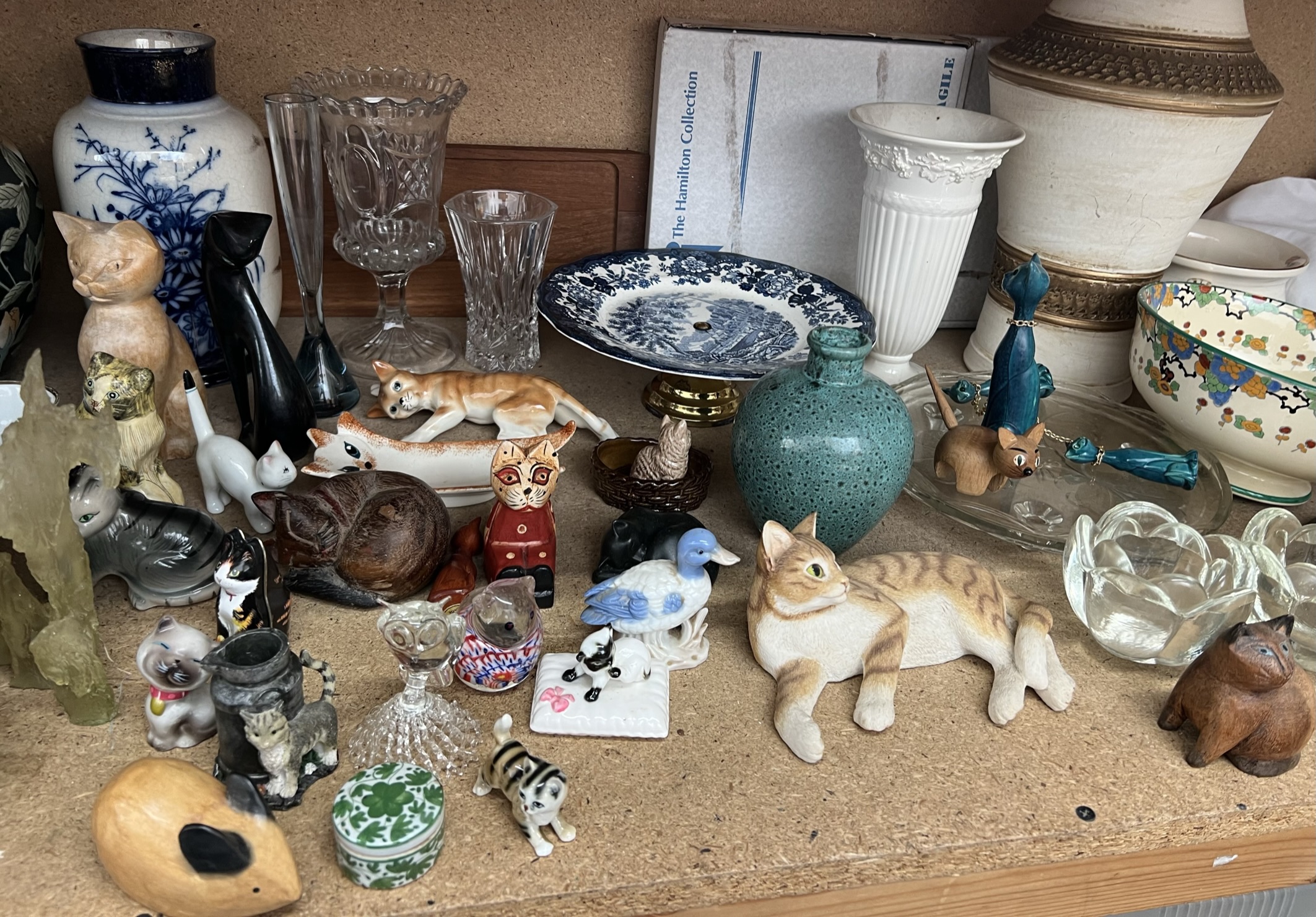 Dragon figures together with assorted vases, cat models,