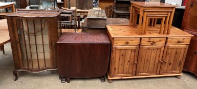 A pine dresser base together with a nest of three tables,