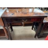 A 19th century mahogany tea table with a rectangular fold over top and a frieze drawer on square