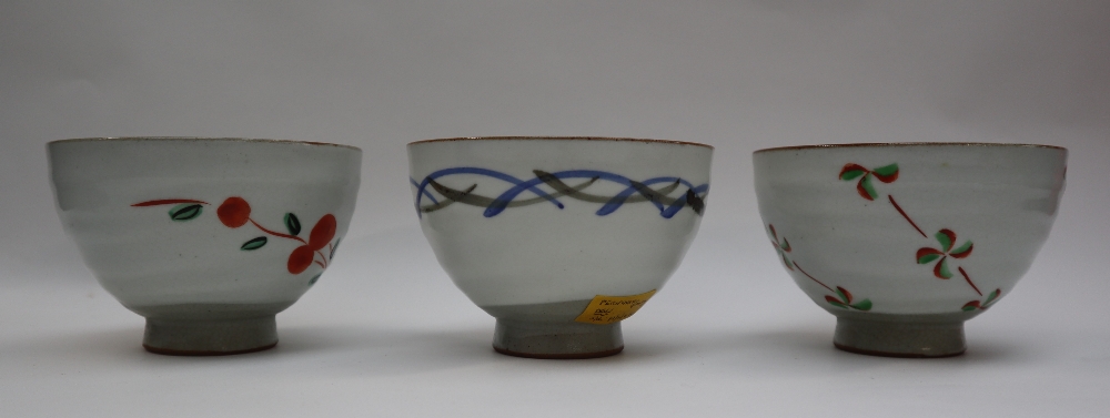 Three assorted stoneware footed bowls in the Chawan style, decorated with flowers and lines, - Image 6 of 6