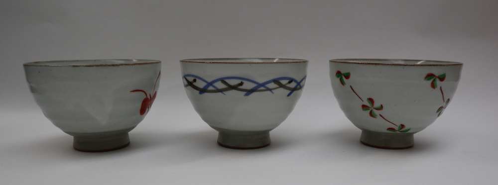 Three assorted stoneware footed bowls in the Chawan style, decorated with flowers and lines, - Image 2 of 6