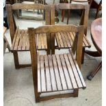 A set of three folding chairs