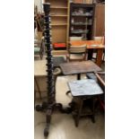 A mahogany torchere with a twisted column on three scrolling legs together with a side table
