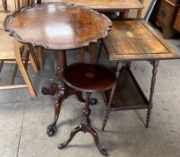 A mahogany tripod table with a pie crust edge on a snap top,