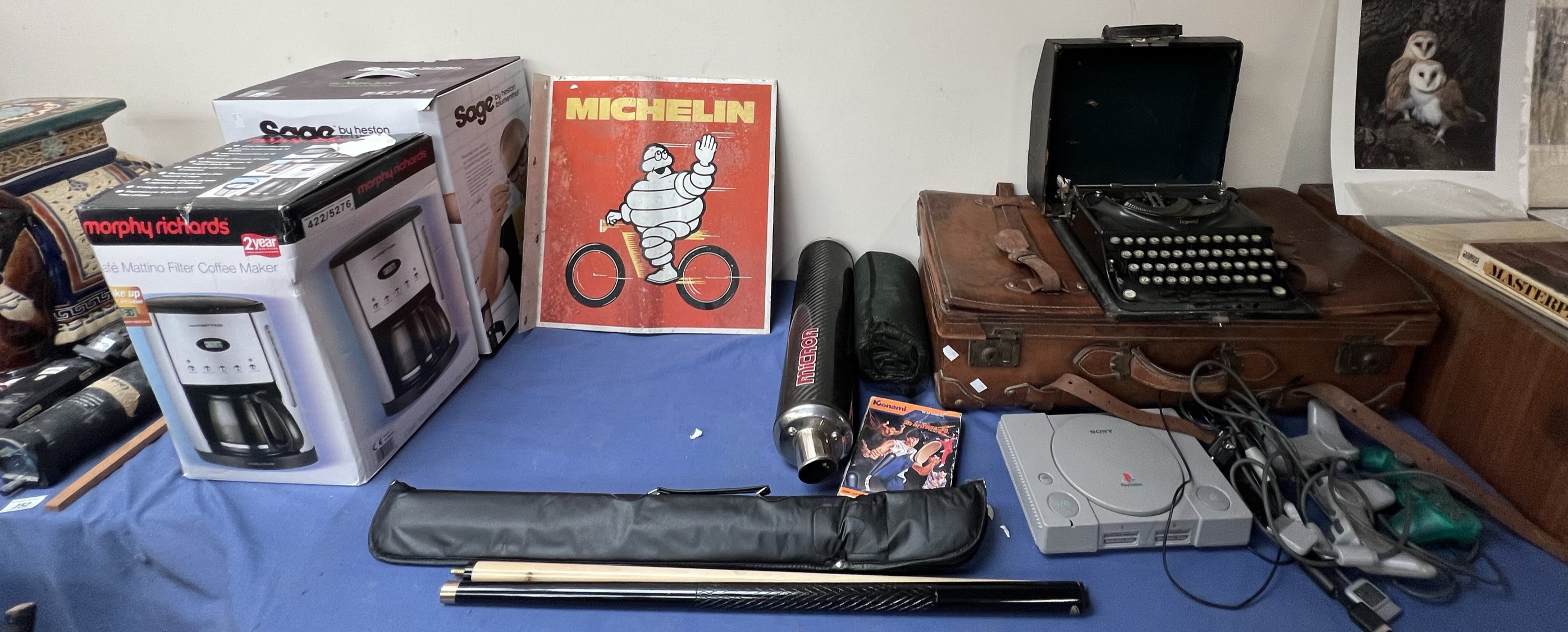 A Michelin double sided tin advertising sign together with a leather case, Imperial typewriter,
