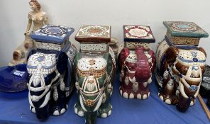 Four pottery elephant garden seats together with a plaster figure of a maiden etc