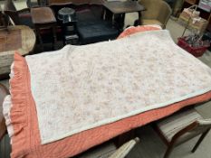 A small wholecloth patterned Welsh quilt together with another wholecloth quilt