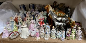 Assorted pottery figures of ladies together with horse figures,