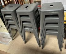 A set of twelve painted metal stacking stools