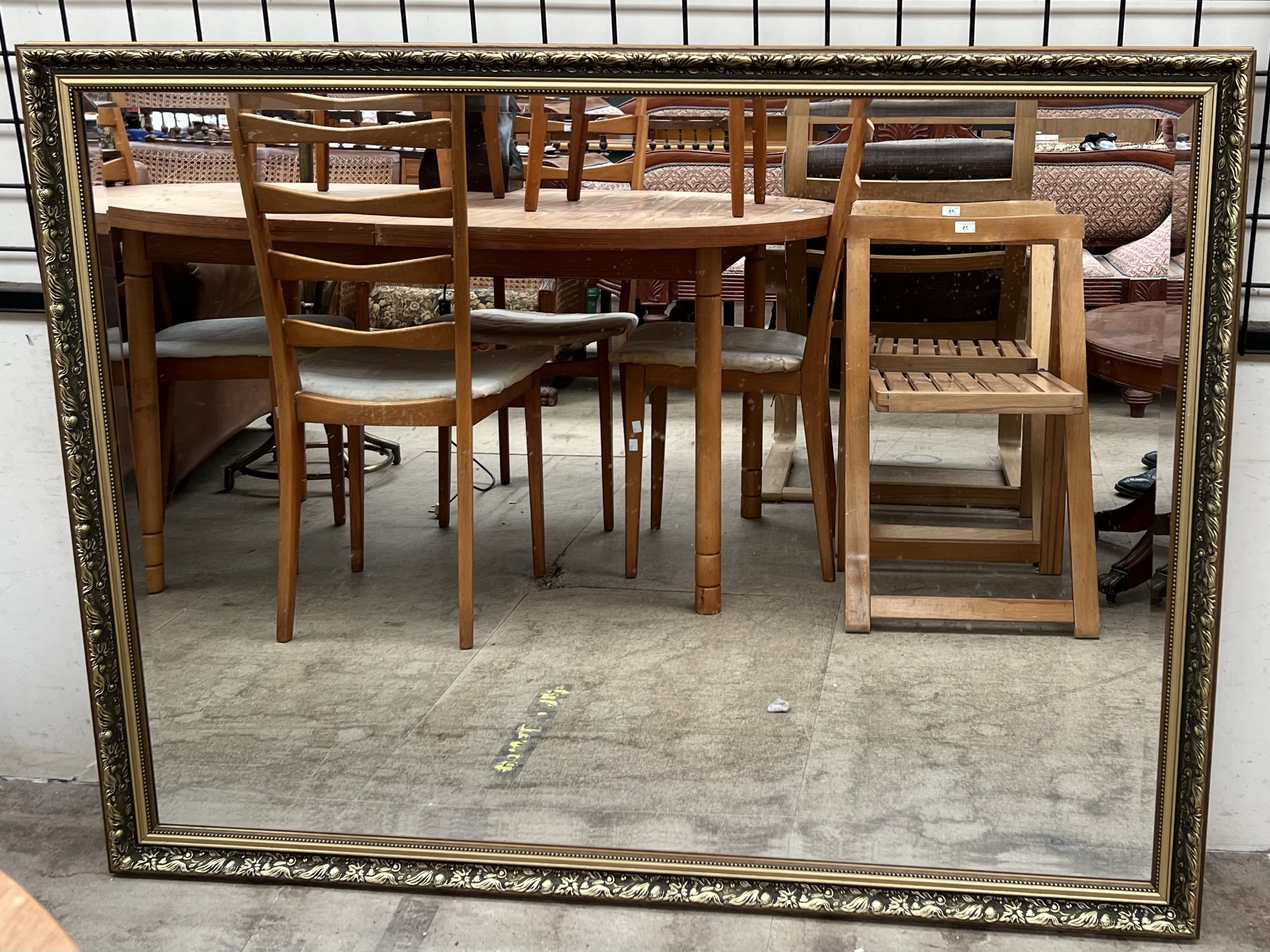 A large gilt framed rectangular wall mirror,