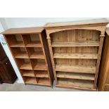 A pine bookcase with a moulded cornice above four shelves on a plinth base,