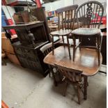 A 20th century oak court cupboard together with an oak dining table, four kitchen chairs,