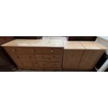 A modern pine chest of seven drawers together with a modern filing cabinet and a matching chest of
