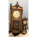 A walnut cased wall clock, with a circular dial,