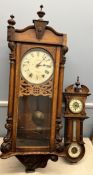 A walnut cased wall clock, with a circular dial,