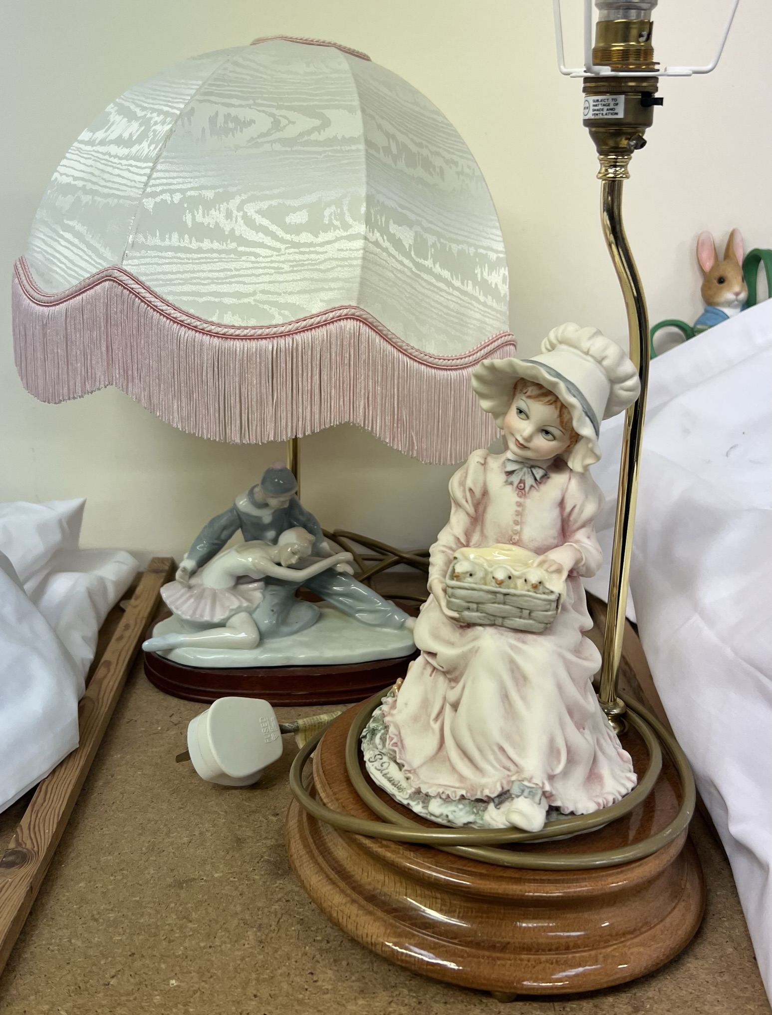 A continental porcelain table lamp base of a ballerina and clown together with another table lamp