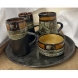 A pottery part coffee set comprising two coffee cups, cream jug,