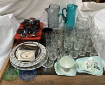 Glass jugs together with drinking glasses, sun glasses, watches,