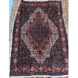 A rug with a central diamond shaped medallion,