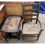 A child's ladder back chair together with a small table with a carved top
