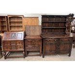 A 20th century oak dresser together with an oak bureau and an oak side cabinet