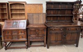 A 20th century oak dresser together with an oak bureau and an oak side cabinet