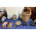 A pair of copper and cast iron andirons together with a wicker basket, bellows, books rumtopf,