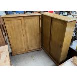 A pair of 20th century side cabinets with sliding doors
